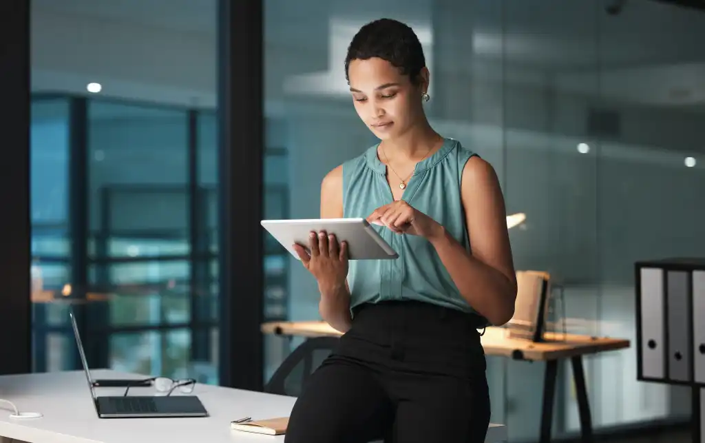Business, black woman and tablet in office, focus and digital planning for growth, startup and sales. Corporate, African American female employee and manager with device, idea and website launch
