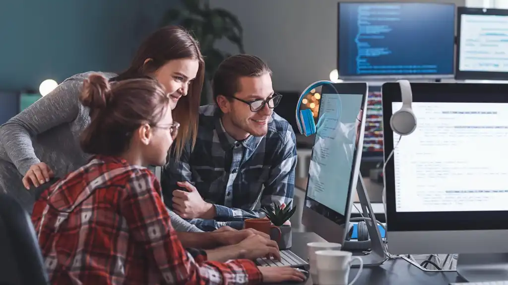 Team of programmers working in office
