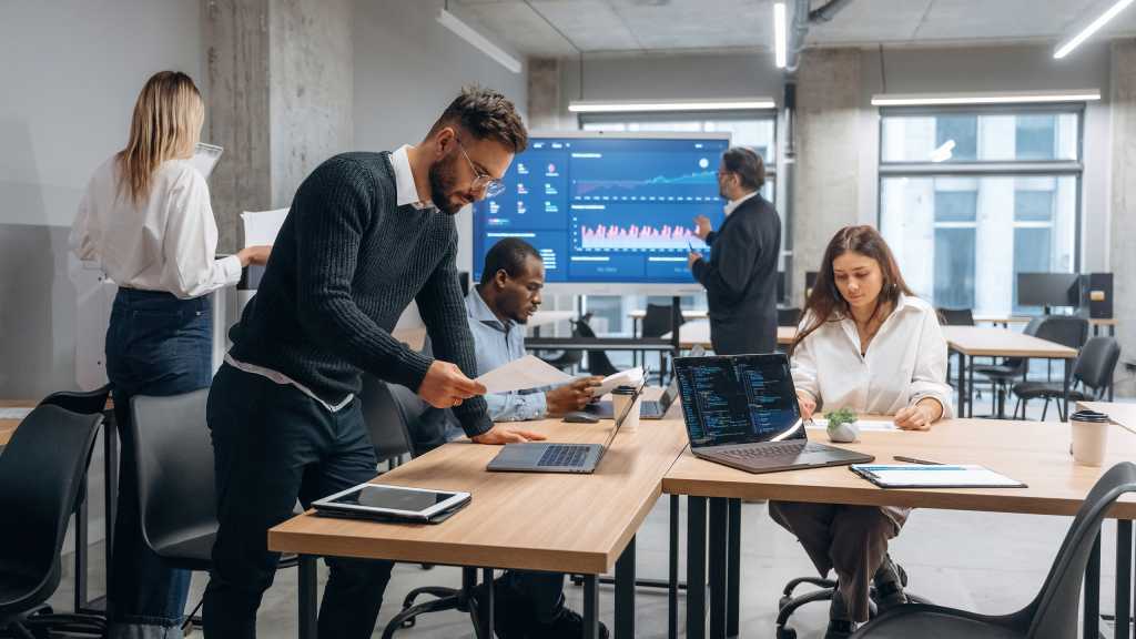 People are busy. Group of office workers are indoors together.