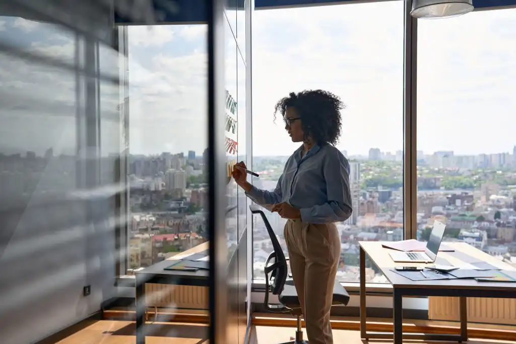 businesswoman at whiteboard